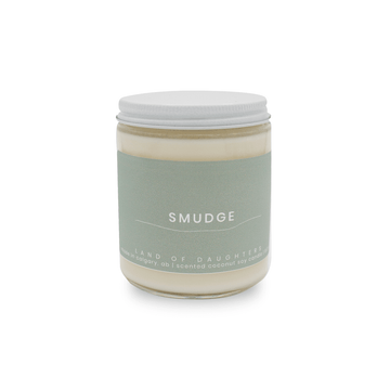 8oz Glass Jar candle with white lid and a light green label that reads Smudge is photographed on a white background.